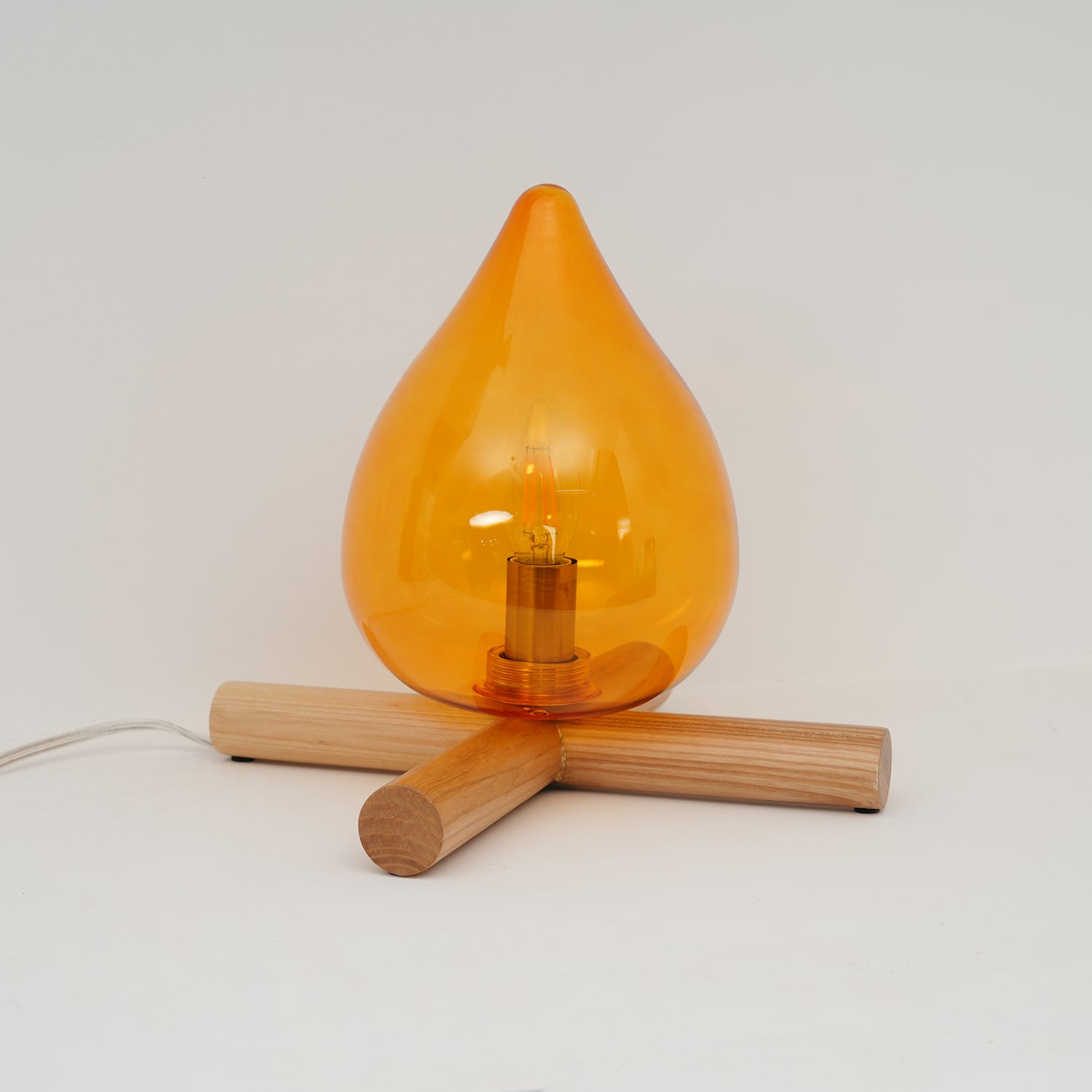 Flame-Inspired Glass Table Lamp With Wooden Cross Base