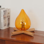 Flame-Inspired Glass Table Lamp With Wooden Cross Base