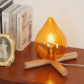 Flame-Inspired Glass Table Lamp With Wooden Cross Base