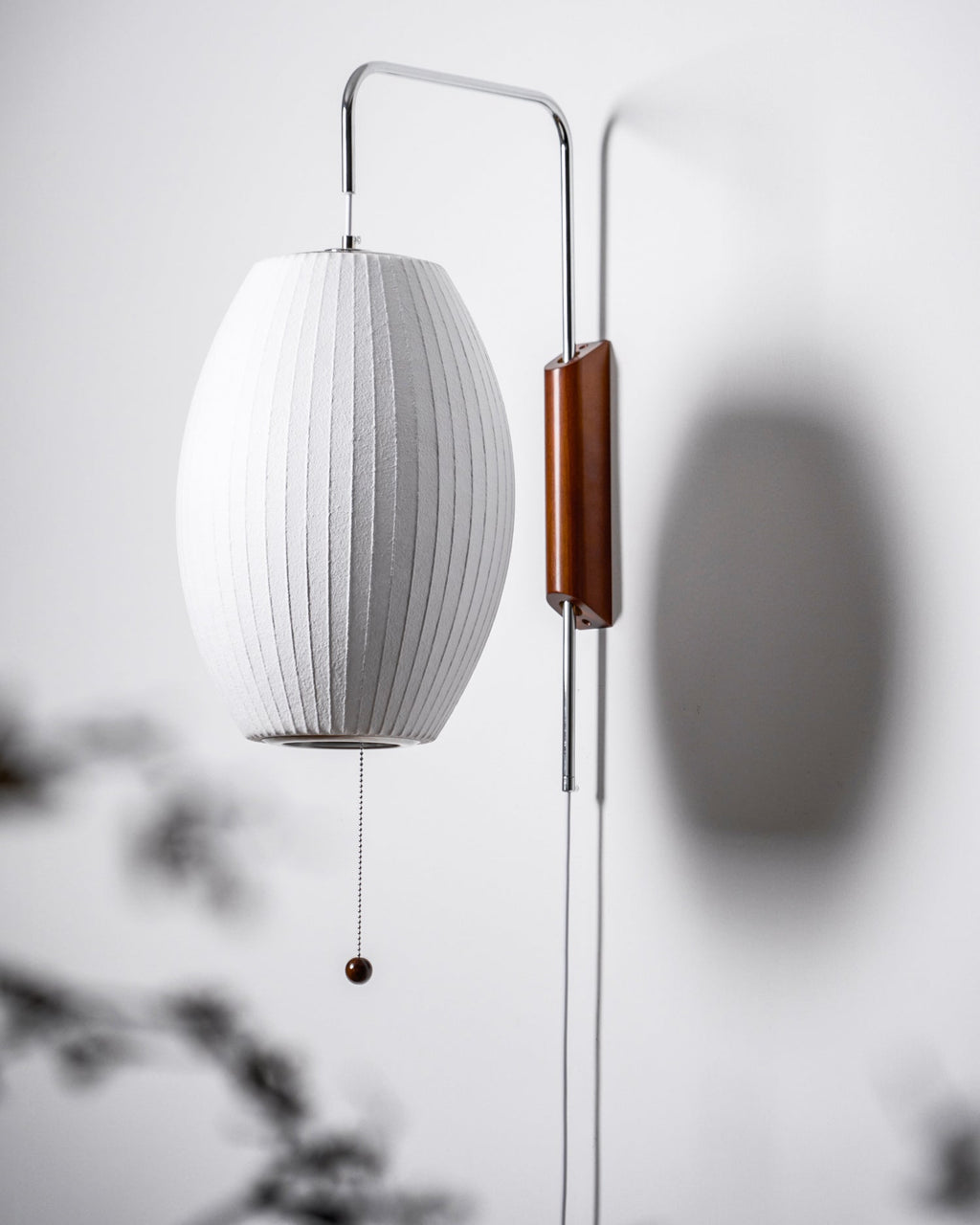 Ribbed Oval Wall Sconce With Pull Chain And Curved Arm