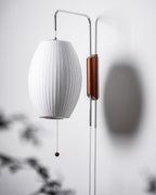 Ribbed Oval Wall Sconce With Pull Chain And Curved Arm