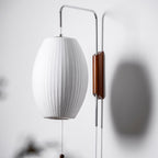 Ribbed Oval Wall Sconce With Pull Chain And Curved Arm