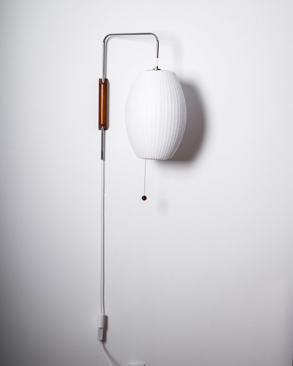 Ribbed Oval Wall Sconce With Pull Chain And Curved Arm
