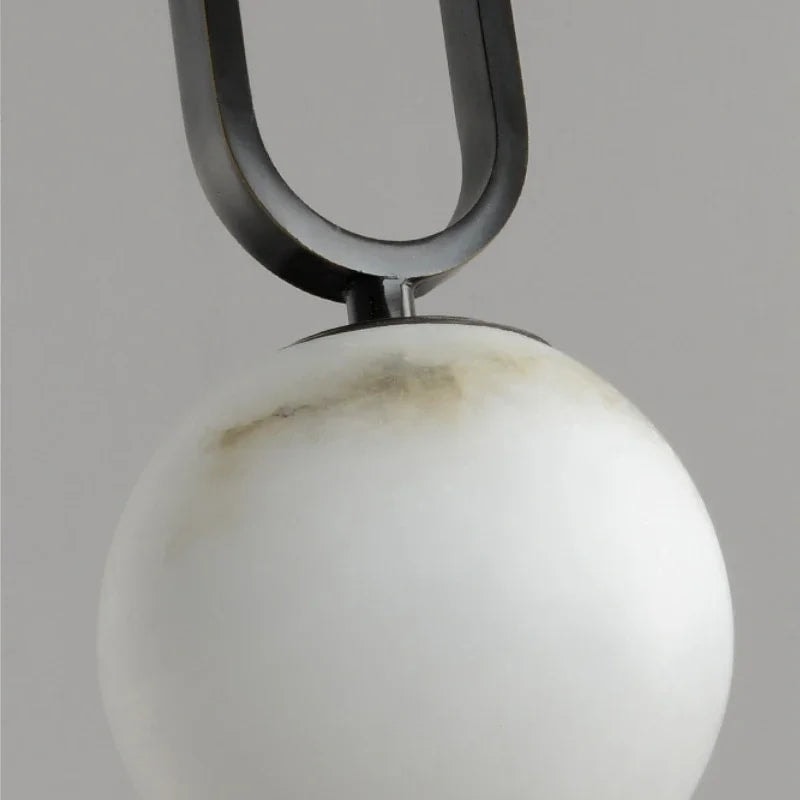 Natural Marble Globe Pendant Light with Black Loop Frame for Bedside Lighting